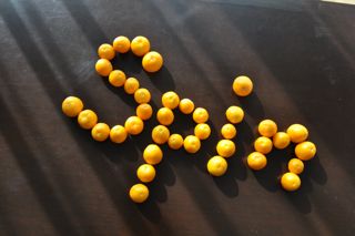 Spin written with kinkan, a Japanese winter citrus fruit